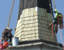 steeple roofing contractor installing a wood shingle roof