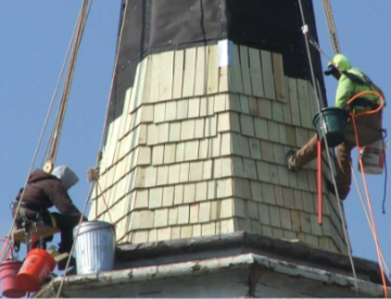 steeple roofing contractor installing a wood shingle roof