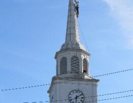 Steeplejacks painting church steeple