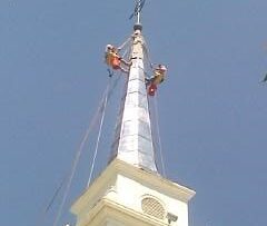 steeplejacks installing lead coated copper spire