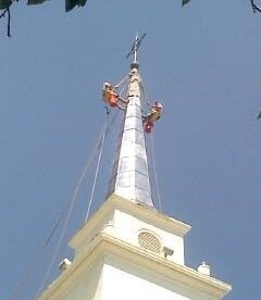 steeplejacks installing lead coated copper spire